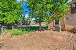 View of yard with central AC unit