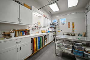 Kitchen with light countertops and white cabinetry