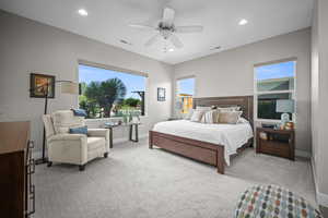 Bedroom with light colored carpet, baseboards, a ceiling fan, and recessed lighting