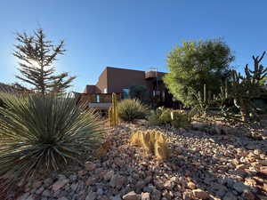 View of side of home featuring stucco siding