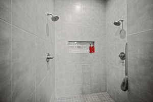 Bathroom featuring a tile shower