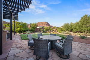 View of patio featuring outdoor dining area and a pergola
