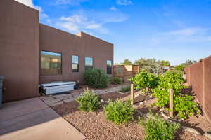 Fenced backyard with a vegetable garden