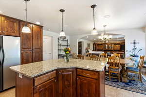 The pantry shows here as part of the cabinets and is right beside the fridge for easy access. The wide open granite counters give you soooo much room to create!