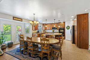 You can see the doors to the left leading to the patio and is open to the kitchen for ease of serving and being together.