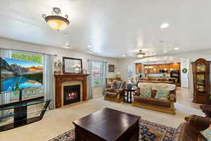 Shows the open layout from family room to dining area to the kitchen.