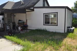 View of property exterior with roof with shingles