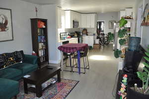 Living area featuring light wood-style flooring