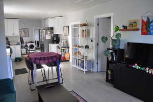 Living area with light wood-style floors