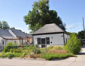 View of front of home with roof with shingles