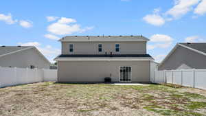 Back of property with a patio, a fenced backyard, and central AC unit
