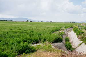 View of yard with a view of countryside and a mountain view