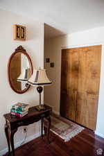 Foyer entrance featuring wood finished floors and baseboards