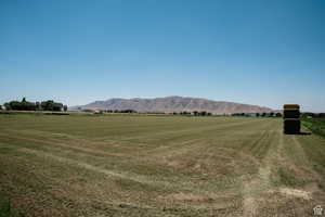 View of mountain backdrop featuring rural landscape
