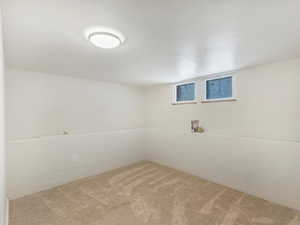 Basement featuring carpet flooring