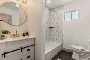 Full bath with vanity, toilet, tile patterned floors, shower / bath combination, and recessed lighting