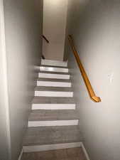 Stairway featuring baseboards