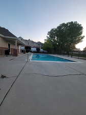 Community pool featuring a patio