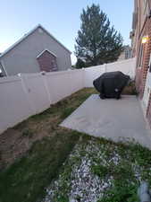 Fenced backyard with a patio area