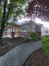 Ranch-style house with brick siding and stucco siding