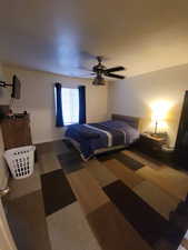Bedroom featuring carpet flooring and a ceiling fan