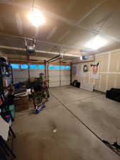 Garage featuring a garage door opener