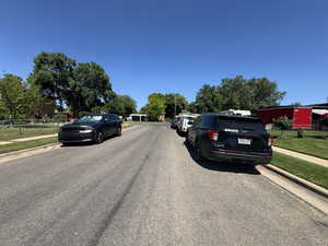 East View of asphalt street with sidewalks and curbs