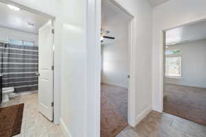 Hall with carpet and baseboards