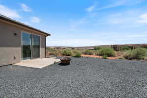 View of yard with a fire pit and a patio area
