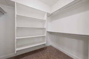 Walk in closet featuring carpet