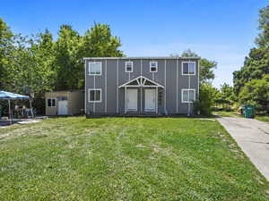 View of front of home featuring a front lawn