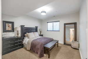 Bedroom with carpet floors and baseboards