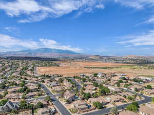 Aerial perspective of suburban area featuring a mountain backdrop
