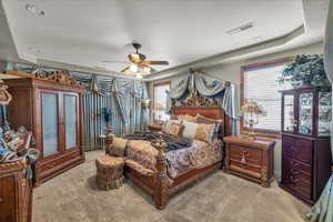 Carpeted bedroom with ceiling fan and recessed lighting