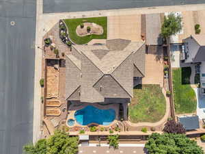 Aerial view of property and surrounding area with a pool