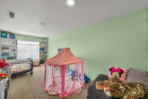 Carpeted bedroom featuring recessed lighting