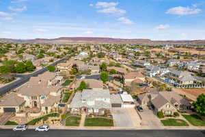 Aerial view of property's location featuring nearby suburban area and a mountain backdrop