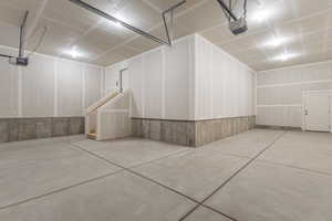 Garage featuring a garage door opener