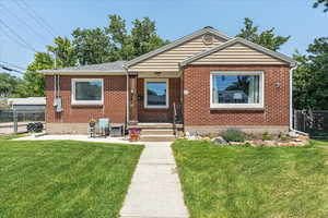 Bungalow-style home featuring brick siding