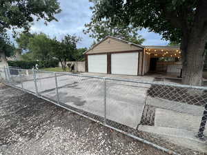 Garage featuring driveway