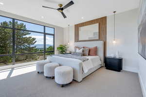 Bedroom featuring light colored carpet, a mountain view, recessed lighting, baseboards, and ceiling fan