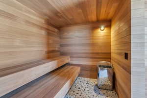 Relaxing sauna featuring wooden walls