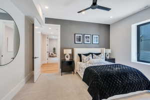 Carpeted bedroom with recessed lighting, ceiling fan, and baseboards