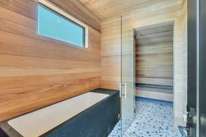 Bathroom with a bathtub and a shower with shower door