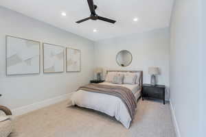 Bedroom featuring light carpet, baseboards, recessed lighting, and ceiling fan