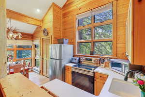 Kitchen with lofted ceiling and plenty of natural light