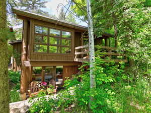 Wall of windows, rear deck plus balcony