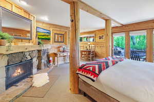 Studio suite with king bed, wood-burning fireplace, dining area, kitchenette and full bath. Opens to deck and hot tub