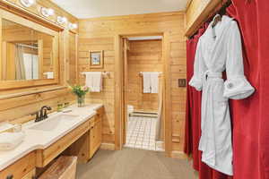 Full bathroom with solid surface countertops and shower/tub