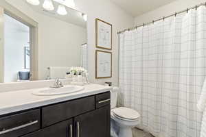 Bathroom featuring toilet and vanity